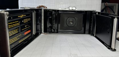 Vintage Polaroid Land Camera Model 95 with hand strap - Image 9