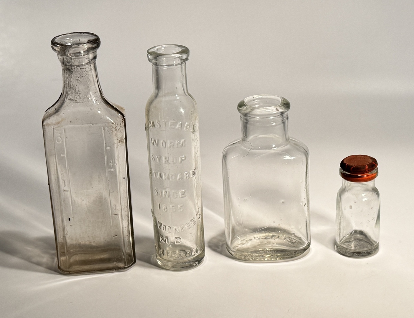 Vintage Clear‑Glass Patent Medicine Bottle Lot – 4 Bottles (1855‑1900) – Embossed & Classic - Worm Syrup - Image 4